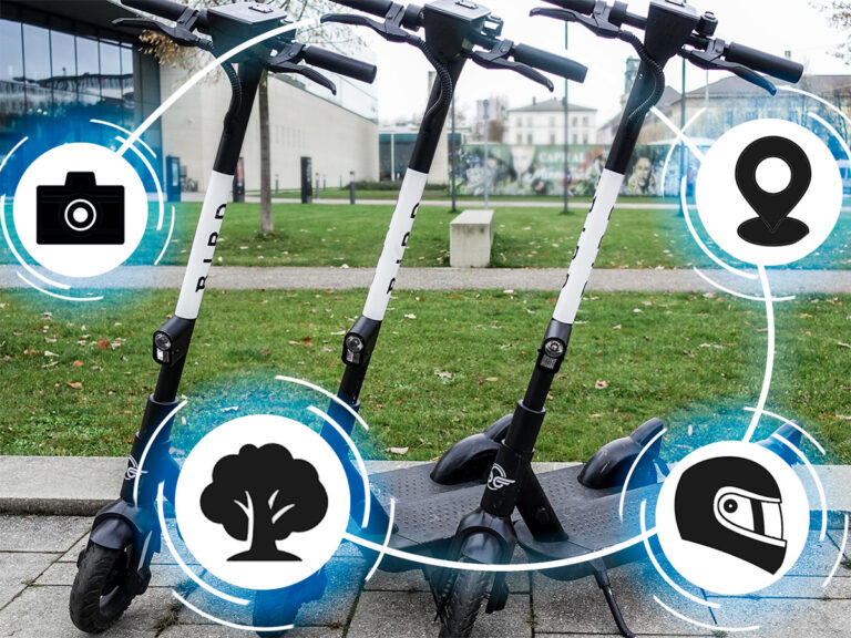 Drei E-Roller stehen nebeneinander und sind von Icons umgeben, die neue Funktionen darstellen.