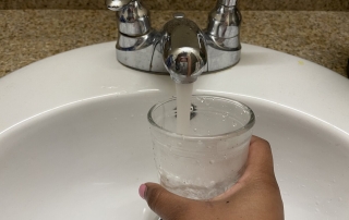 Filling a glass of water.