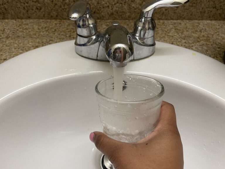 Filling a glass of water.